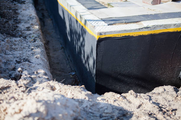 Professional Waterproofing technician working in Ithaca, NY